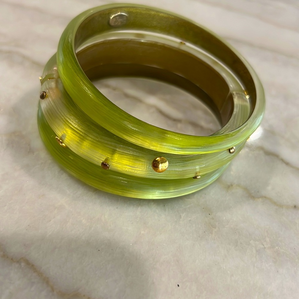 Alexis Bittar green lucite bracelets.